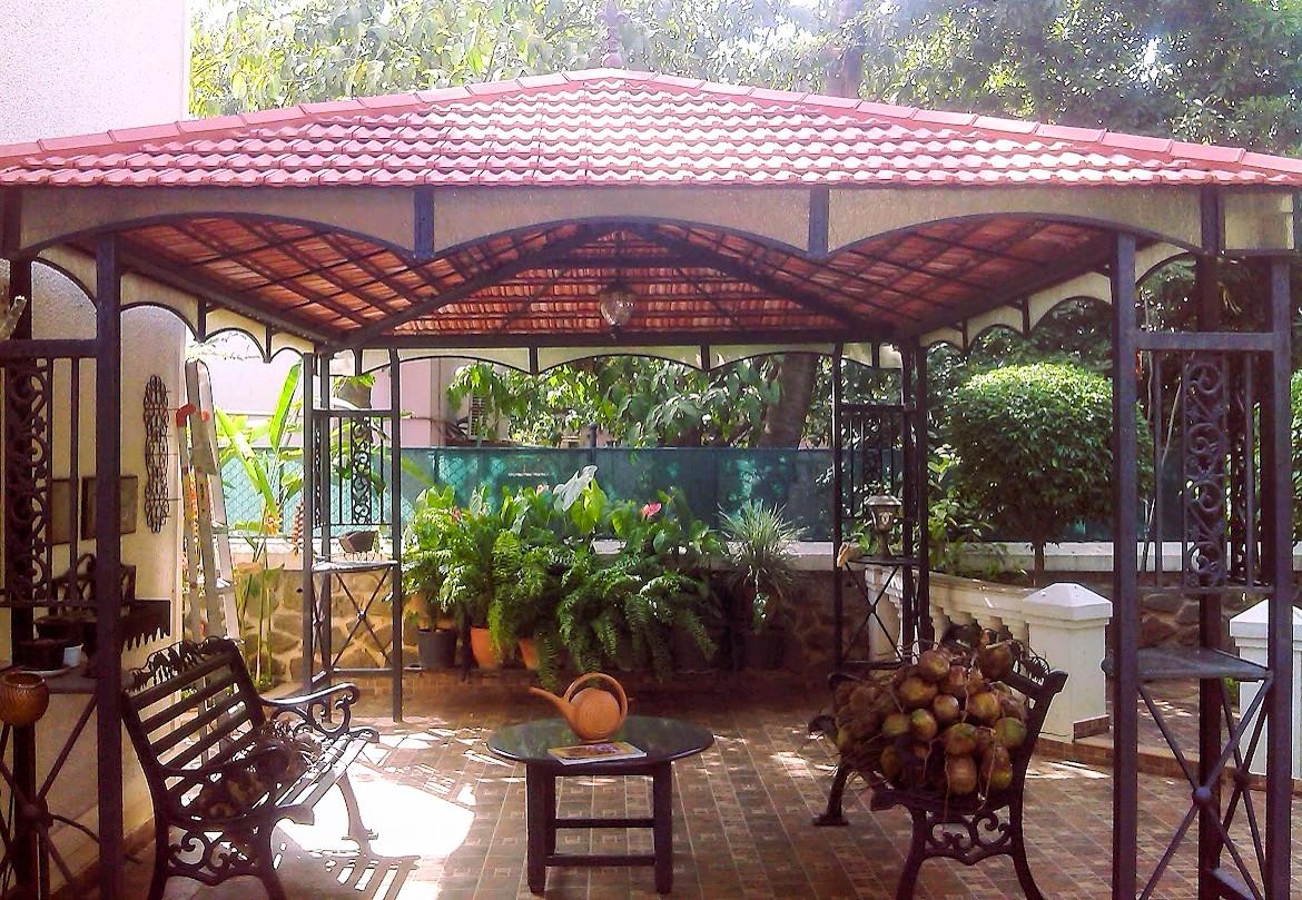 Garden pergola with a metal frame